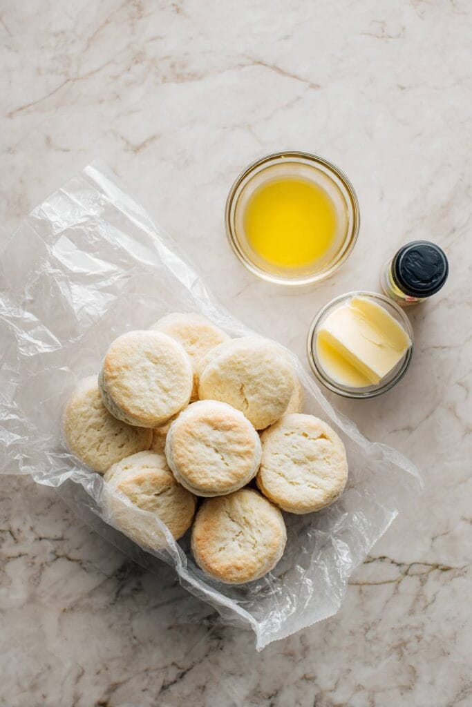 Ingredients for air fryer canned biscuits including Pillsbury tube and butter