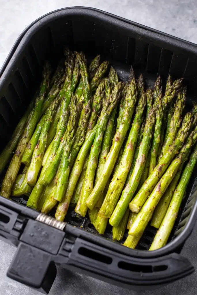 Frozen Asparagus in Air Fryer 3 Frozen asparagus in air fryer basket single layer